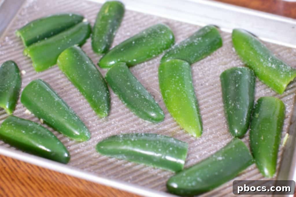 Dynamite Chicken Jalapeño Poppers 5 Broiled Jalapeno Halves on a Baking Sheet