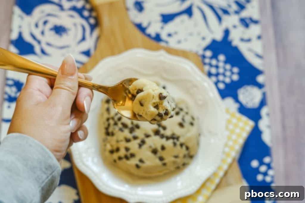 Bowl of finished edible cookie dough with a spoon.
