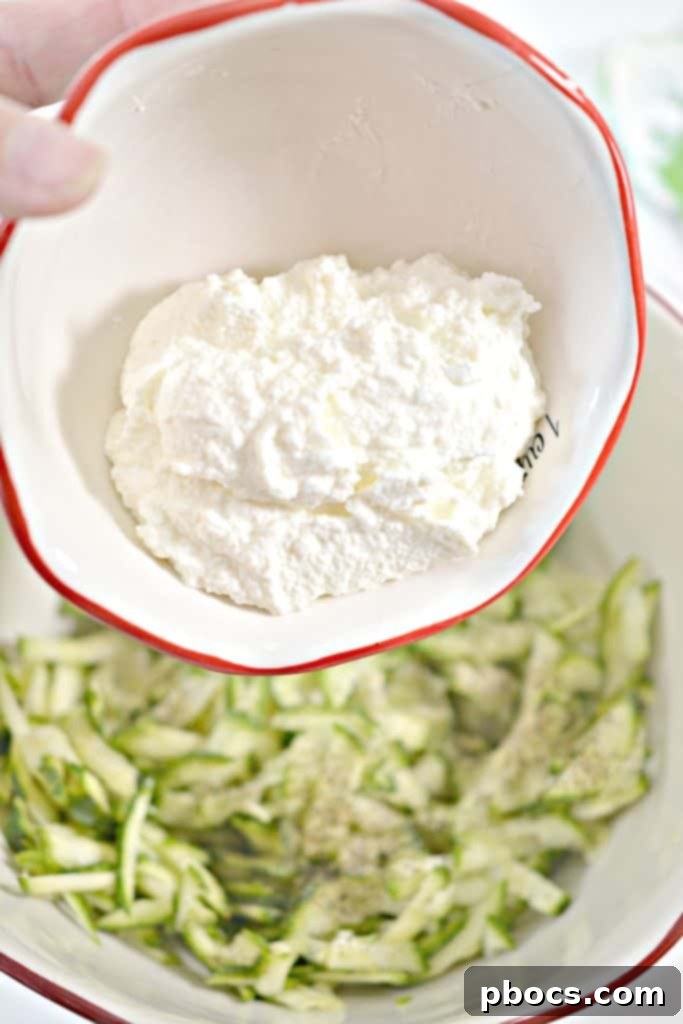 Savory Keto Zucchini Bites 8 Keto Zucchini Fritters preparation step: finely shredded zucchini.