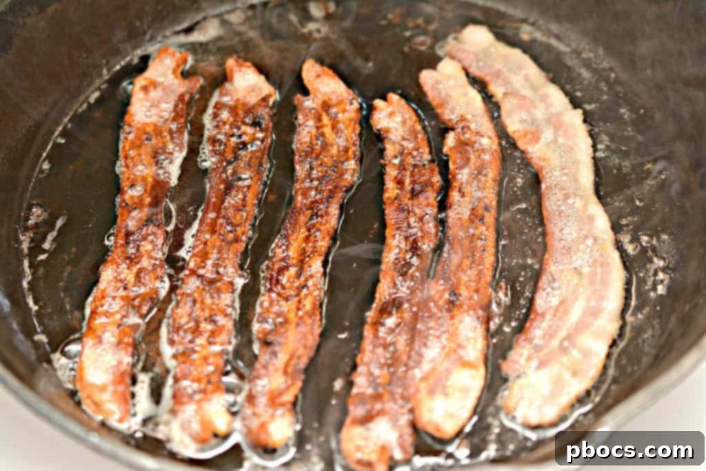 Cooking Bacon for Keto Jalapeno Popper Fat Bombs
