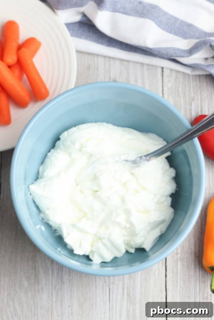 Step 1: Combining Greek yogurt and ranch dressing mix in a bowl