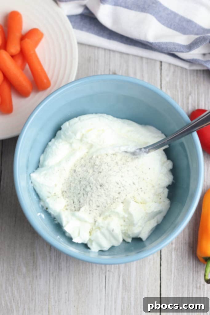 Step 2: Whisking Greek yogurt and ranch dressing mix until smooth