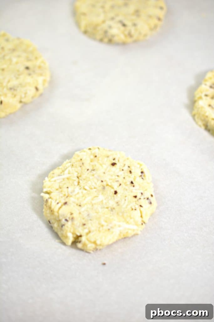An oven rack with parchment paper, indicating readiness for baking.