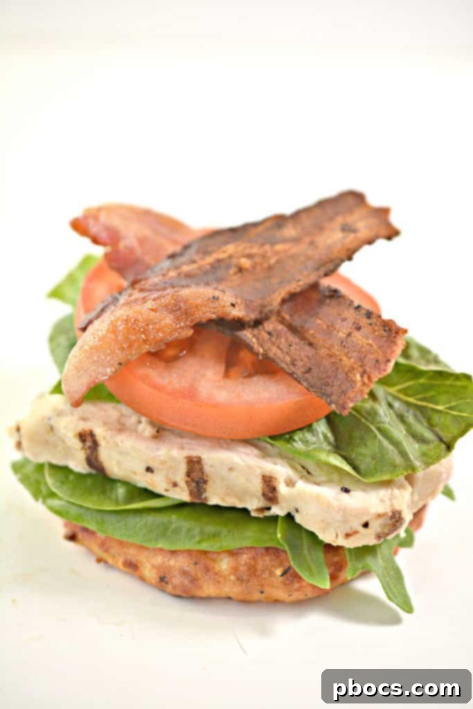 Freshly baked keto cheese buns cooling on a baking sheet, golden brown and perfectly formed.