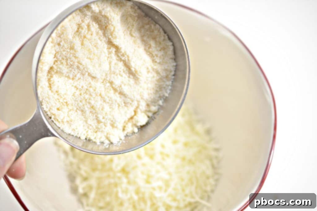Bacon strips frying in a skillet, showing more progress in cooking and crisping.