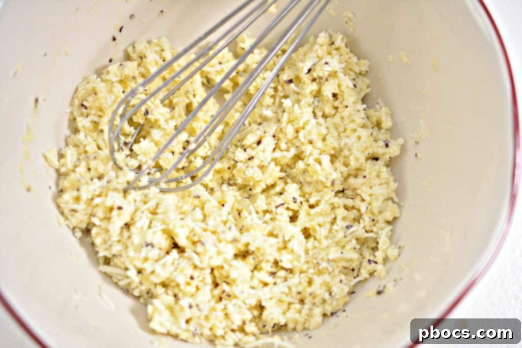 The cheese bun mixture after being thoroughly combined in a mixing bowl.