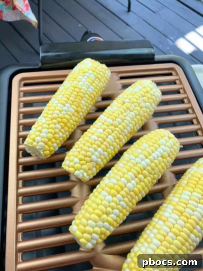 First Cookout with Watermelon Jalapeno Feta Salad 3 Close-up shot of a portable smokeless grill in action, with skewers and vegetables cooking perfectly, illustrating its ease of use for summer parties.