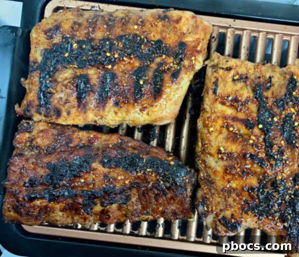 Pork ribs grilling over indirect heat
