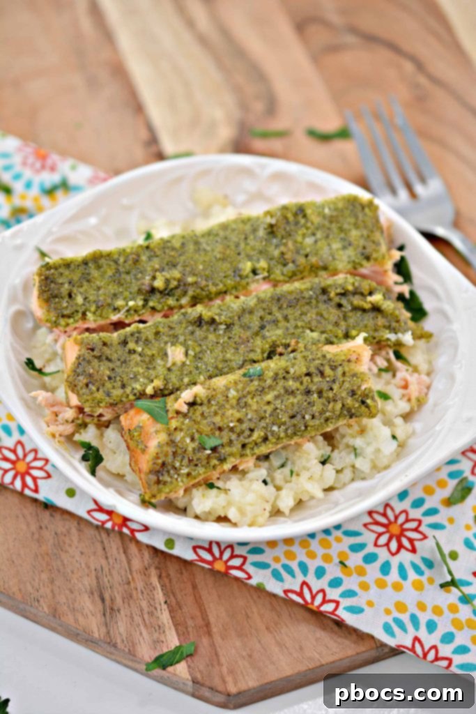 Vibrant Keto Pesto Salmon Bowl 2 Keto Pesto Salmon Bowl - Close up of finished dish with salmon, pesto, and cauliflower rice