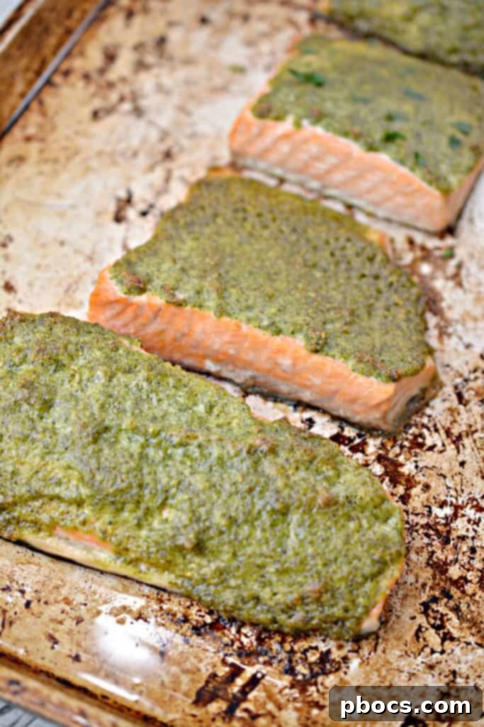 Vibrant Keto Pesto Salmon Bowl 14 Keto Pesto Salmon Bowl - Final presentation of the dish with salmon on a bed of cauliflower rice