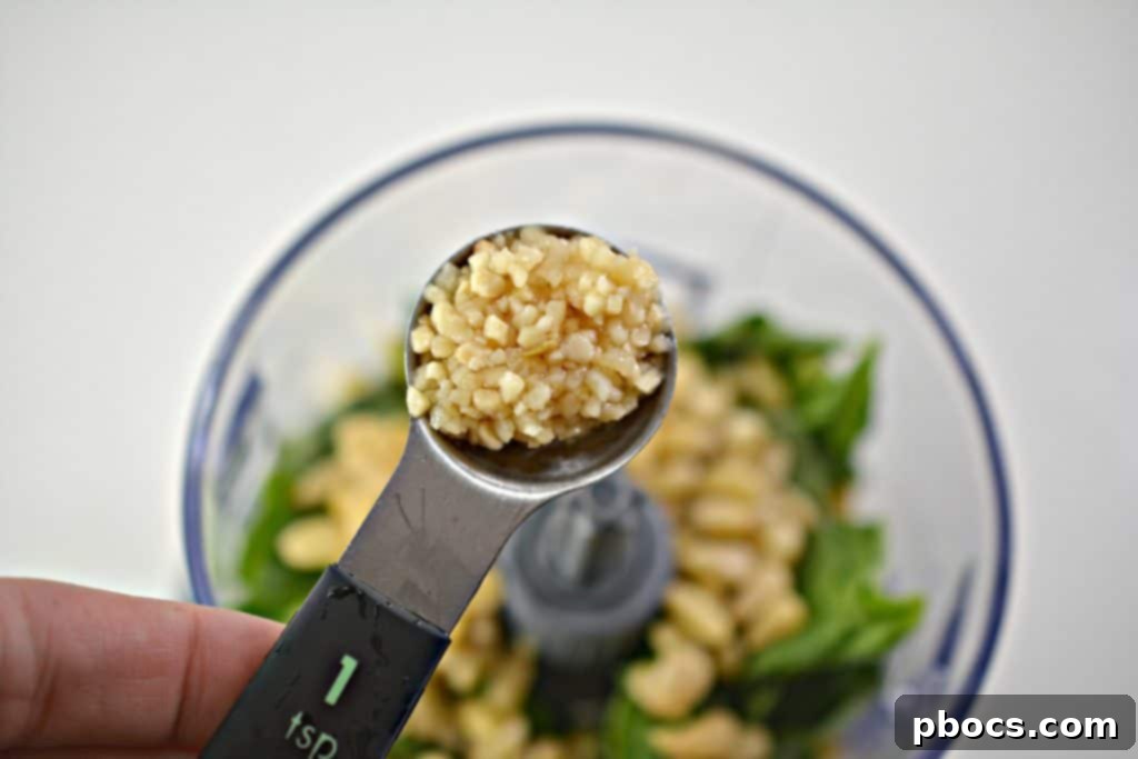 Vibrant Keto Pesto Salmon Bowl 8 Keto Pesto Salmon Bowl - Freshly blended, smooth green pesto in a food processor