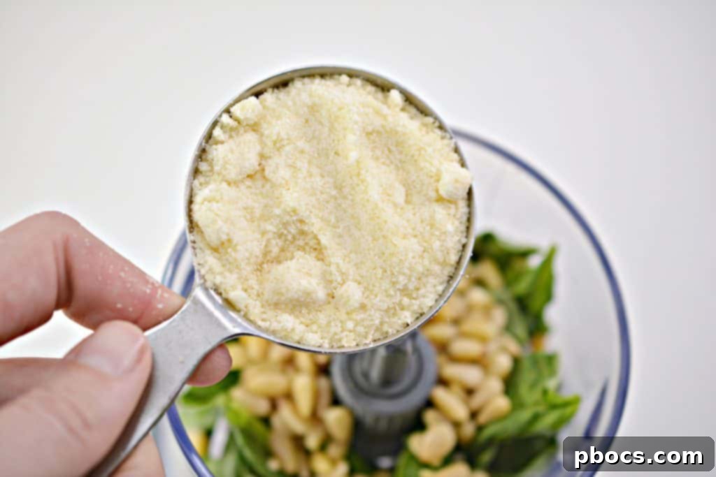 Vibrant Keto Pesto Salmon Bowl 9 Keto Pesto Salmon Bowl - Adding whole pine nuts to pesto ingredients