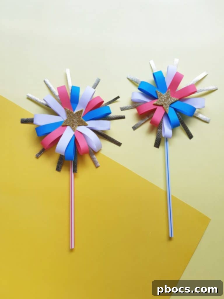 Kids holding colorful paper firework wands for 4th of July