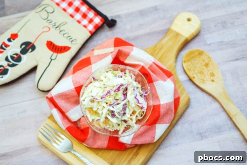 Easy Keto Coleslaw Recipe served alongside grilled food, ready for a summer picnic