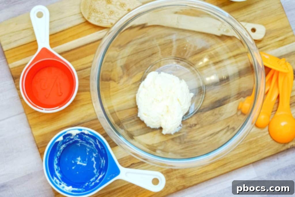 Whisking mayonnaise, vinegar, erythritol, mustard, and salt together for the coleslaw dressing