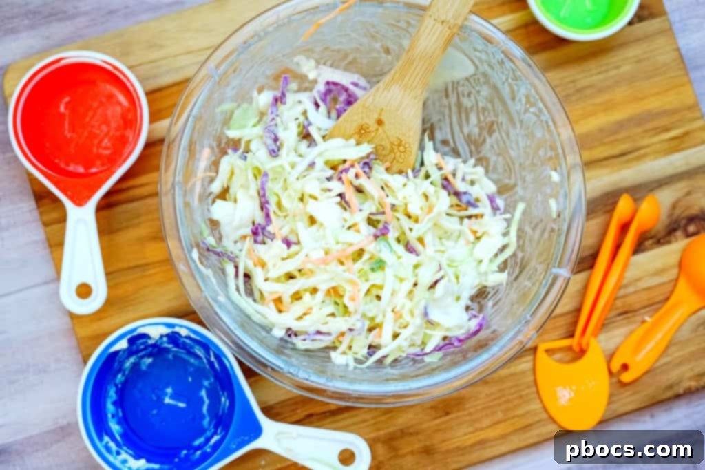 Shredded cabbage and lemon juice added to the coleslaw dressing