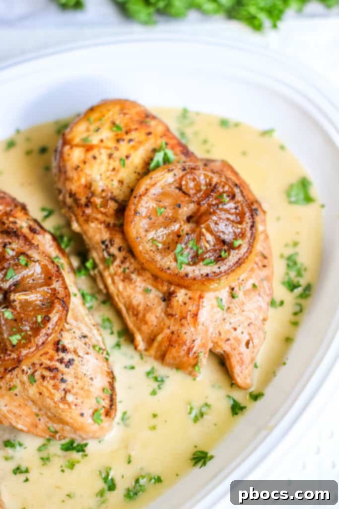 Velvety Lemon Keto Chicken 3 Slow cooker filled with Low Carb Creamy Lemon Chicken during cooking