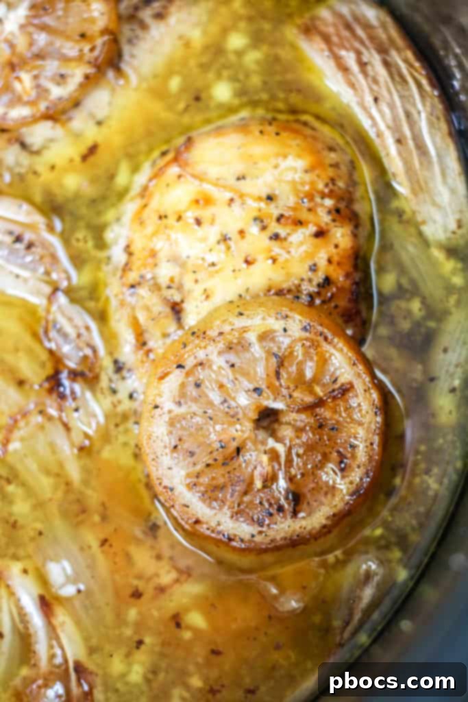 Velvety Lemon Keto Chicken 9 Pouring chicken stock and lemon juice into a skillet to deglaze after searing chicken