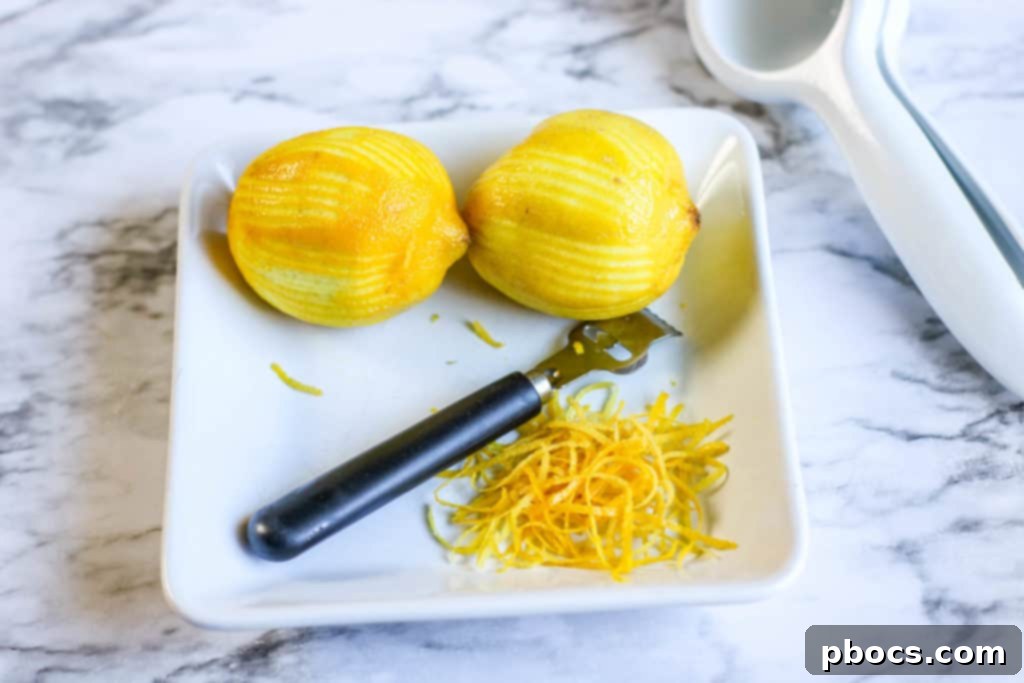 Velvety Lemon Keto Chicken 10 Chicken in slow cooker with red onion wedges, lemon zest, garlic, and butter