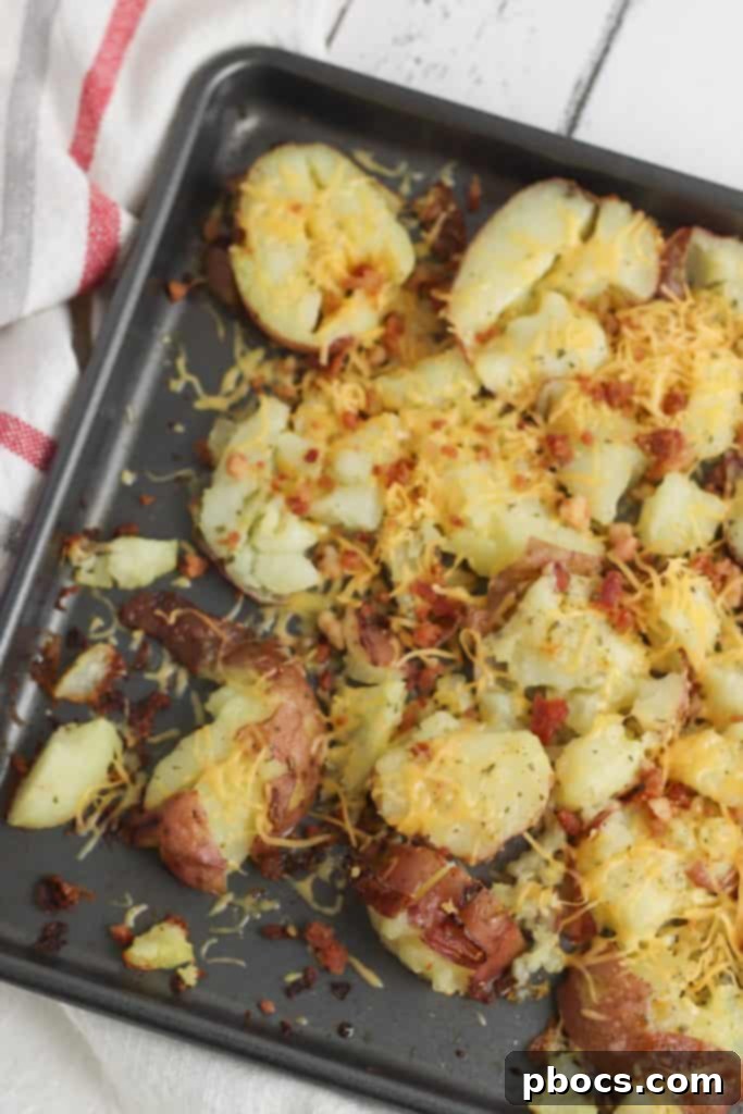 Smash Hit Bacon Cheddar Ranch Potatoes 13 Brushing ranch butter mixture onto smashed potatoes