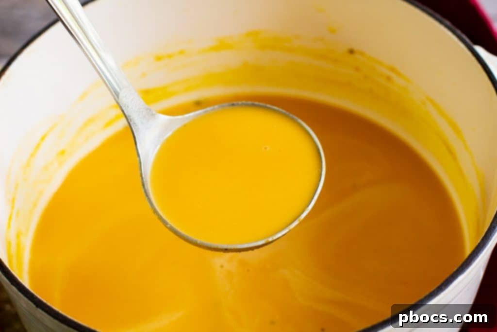 Keto Pumpkin Soup heating on stovetop