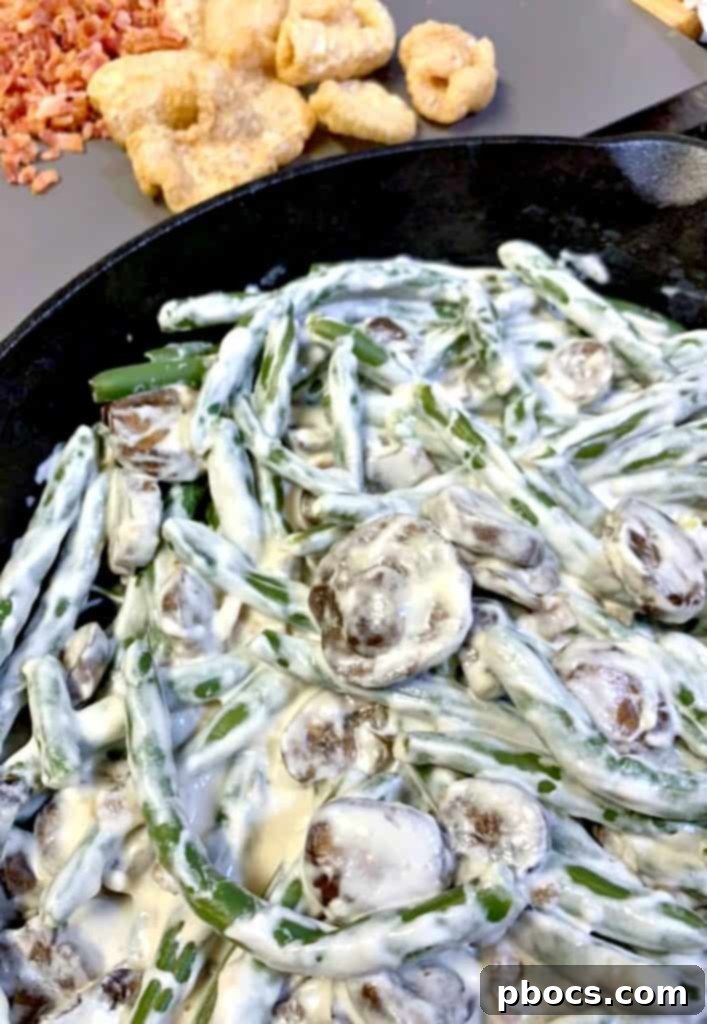 Making keto green bean casserole sauce in a cast iron skillet