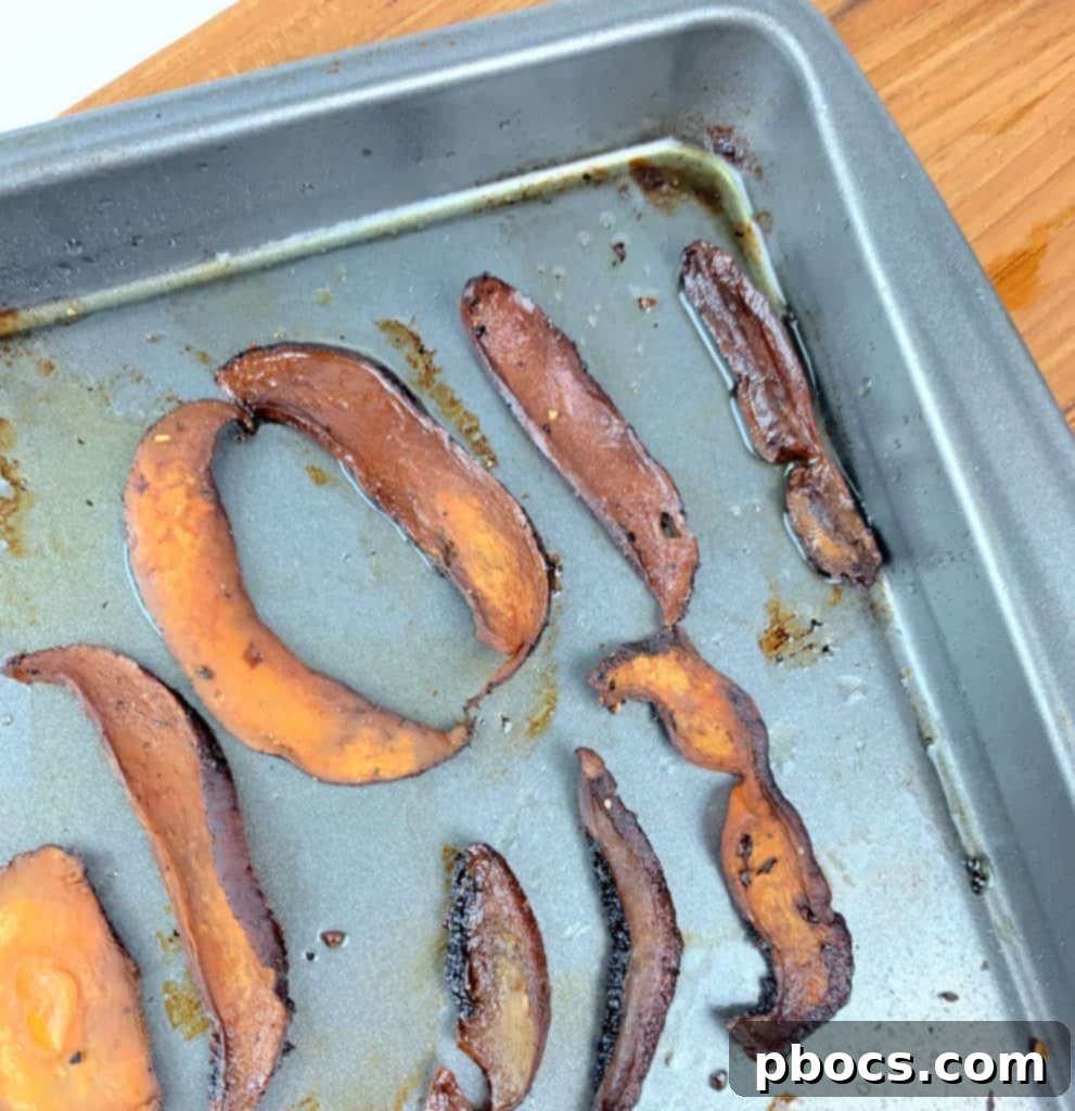 Emerald Pesto Pasta Bowl 3 Sliced Portobello mushrooms on a baking sheet, brushed with olive oil and seasoned for 'mushroom bacon'.