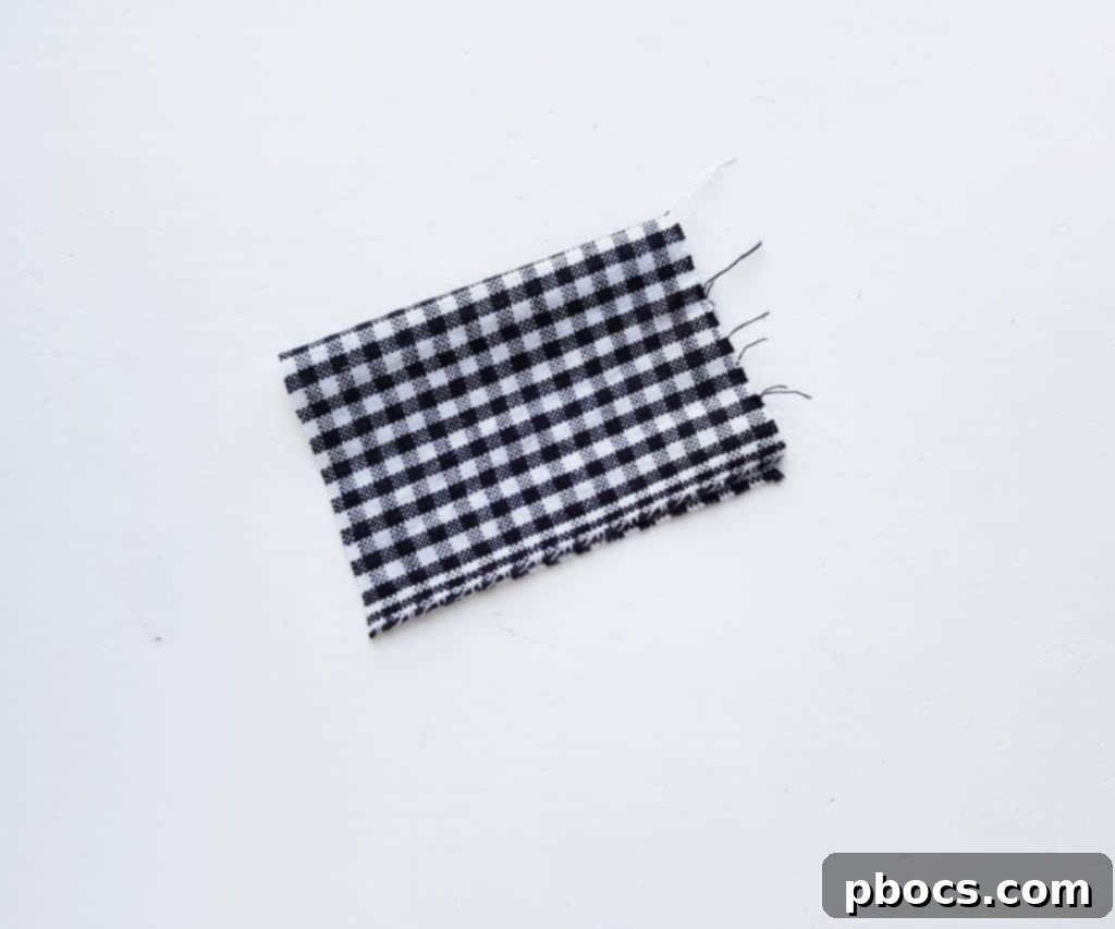 Scarecrow Craft Step 2: Folding fabric for shirt