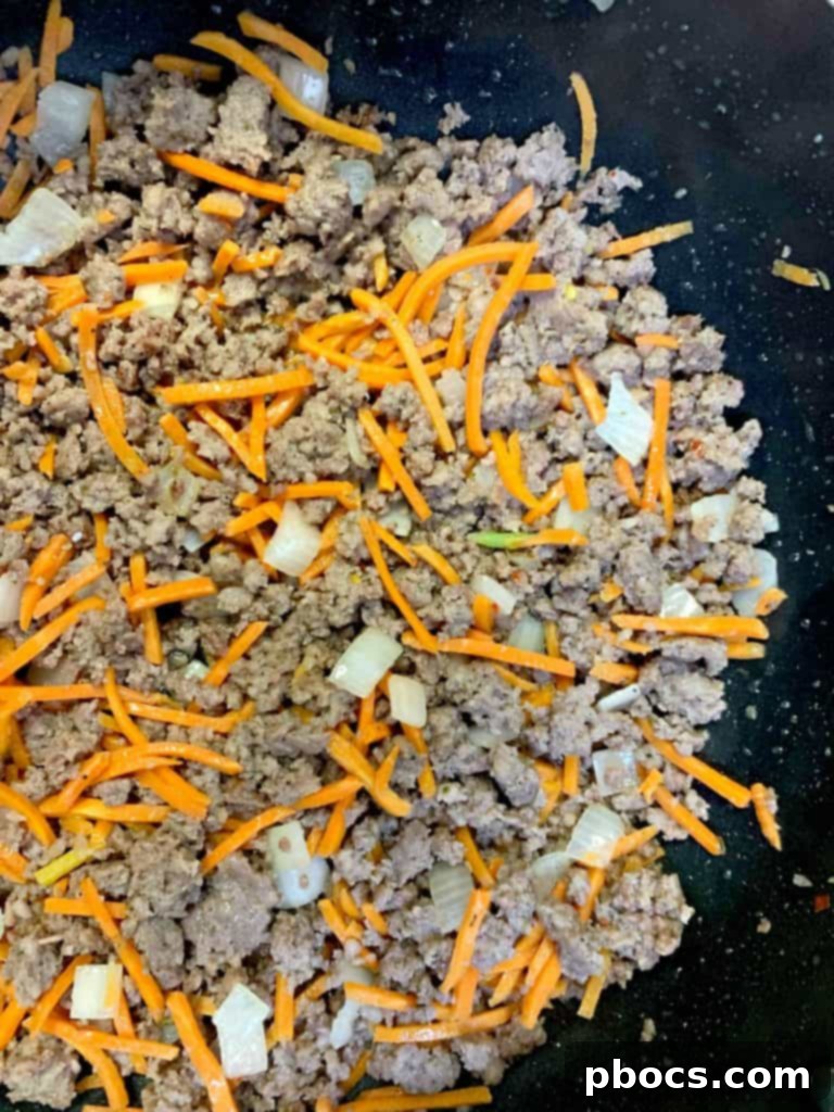 Sautéing onions and carrots with sesame oil