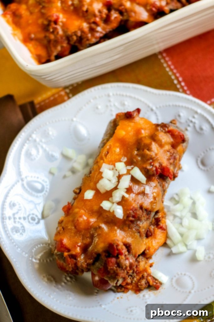Delicious Low Carb Chili Cheese Dog Bake in a casserole dish, topped with melted cheese.