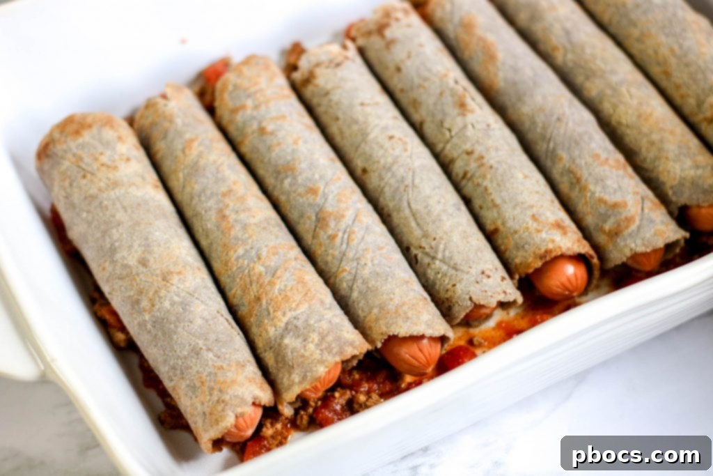 Adding chili to the casserole dish.