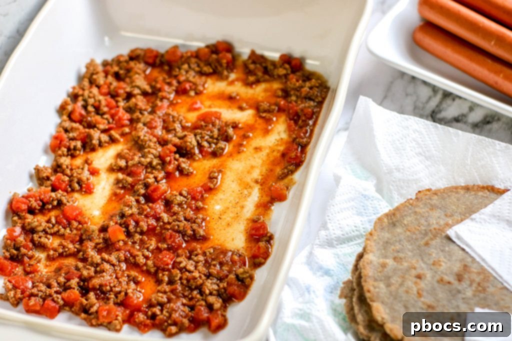 Spoon chili mixture into the bottom of a casserole dish.