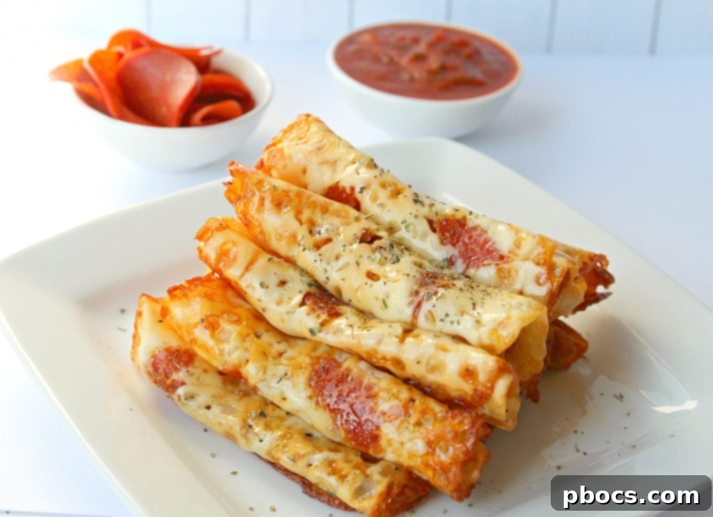 Keto Pizza Pinwheels 4 Child-friendly Keto Pizza Roll Ups arranged on a plate