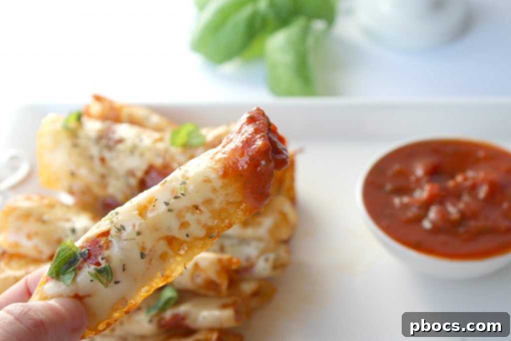 Seasoned mozzarella slices with pepperoni ready for rolling