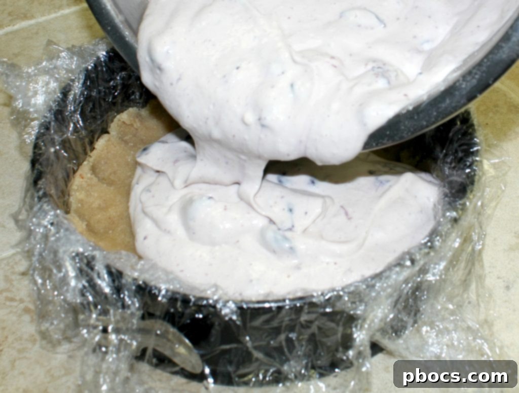 Mixing the keto cheesecake filling ingredients.