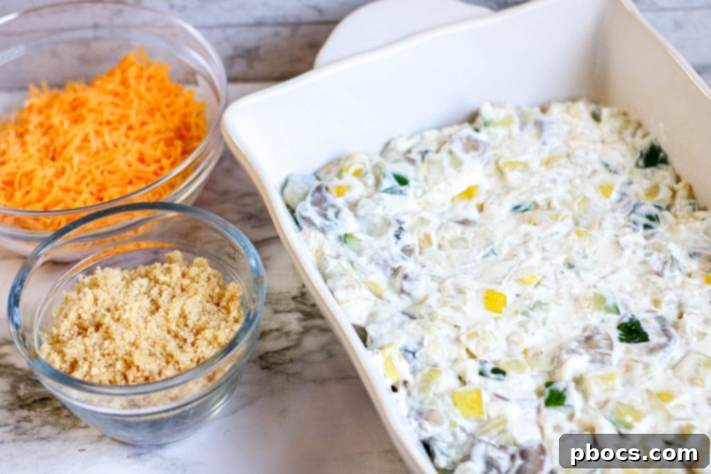 Folding vegetables into cream cheese mixture for casserole