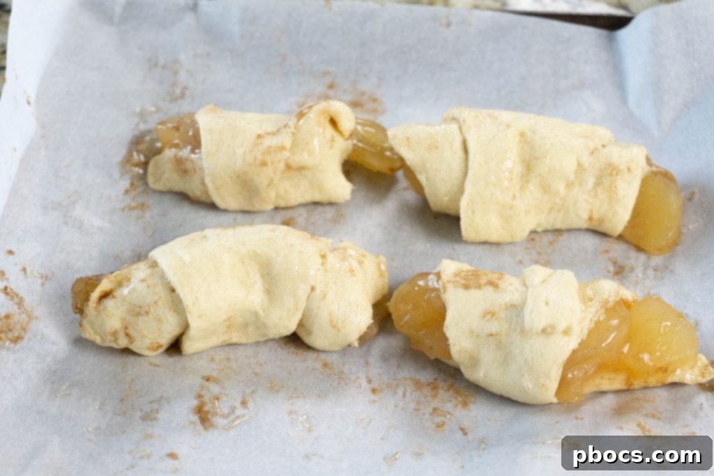 Quick Apple Crescent Pastries 9 Baked Golden Apple Crescent Rolls on Baking Sheet
