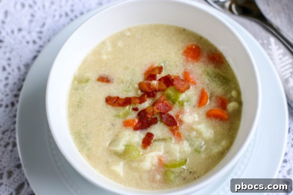 Creamy Keto Bacon Cauliflower Chowder 10 Low Carb Bacon Cauliflower Chowder served with bacon and cheese