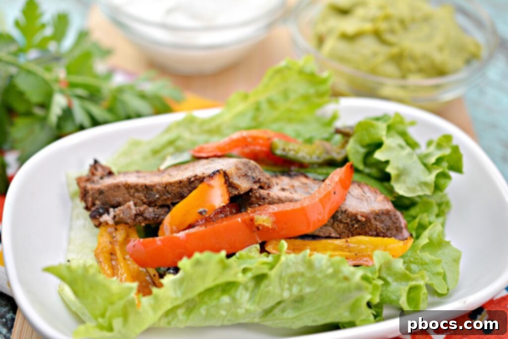 Sizzling Keto Steak Fajita Lettuce Wraps 5 Various colorful toppings for Keto Steak Fajitas on a platter.