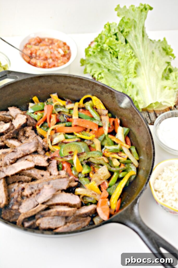 Sizzling Keto Steak Fajita Lettuce Wraps 6 Arranged Keto Steak Fajitas Lettuce Wraps with toppings for a healthy meal.