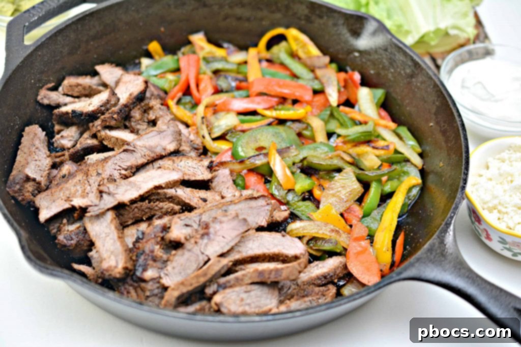 Sizzling Keto Steak Fajita Lettuce Wraps 10 Cooked sirloin steak resting on a cutting board, ready to be sliced.