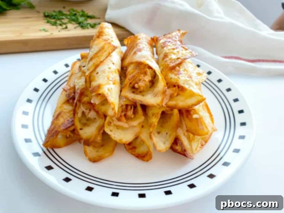 Crispy Keto Buffalo Chicken Taquitos 11 Plated Keto Buffalo Chicken Taquitos with garnishes