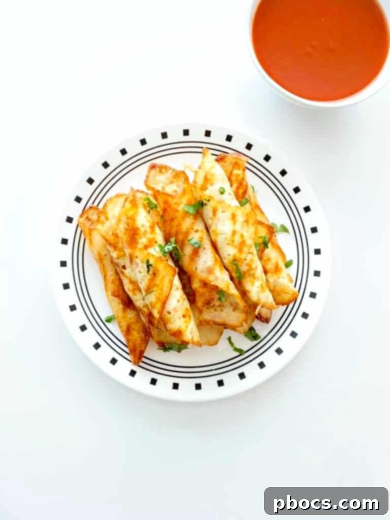 Crispy Keto Buffalo Chicken Taquitos 3 Close-up of freshly rolled Keto Buffalo Chicken Taquitos