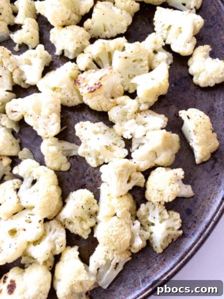 Keto Cheeseburger Cauliflower Bake 6 Cauliflower florets tossed in olive oil, salt, and pepper on a baking sheet
