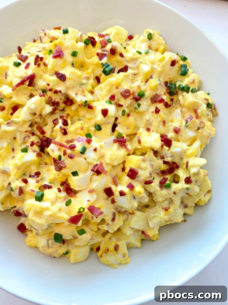 Close-up shot of Keto Deviled Egg Salad, showcasing its creamy texture and fresh ingredients.
