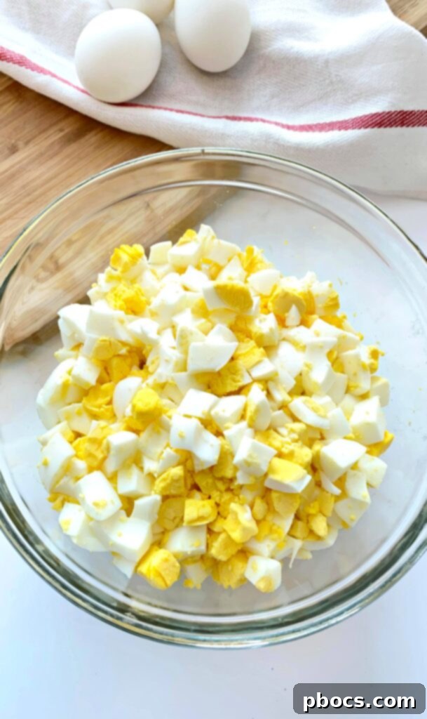 Peeled and chopped hard-boiled eggs in a bowl, ready for mixing.