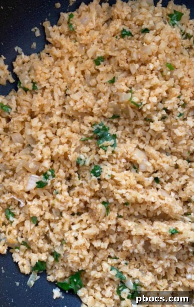 Mixing lime juice and cilantro into Mexican cauliflower rice