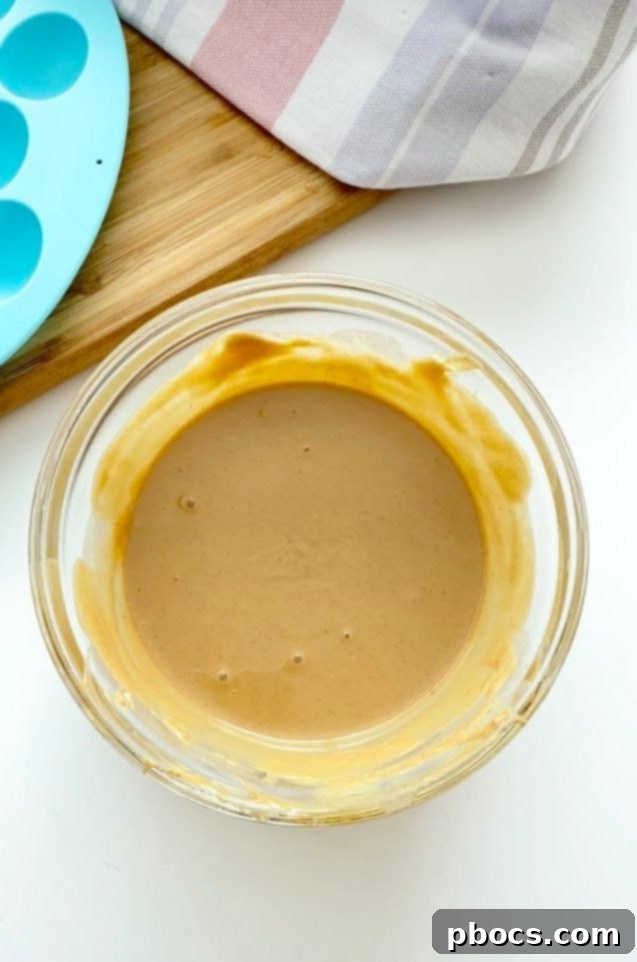 Guilt-Free Keto Chocolate Easter Eggs 5 Stirring erythritol into the melted peanut butter mixture for Keto Chocolate Easter Eggs.