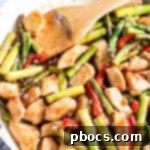 Effortless Low Carb Chicken Asparagus Stir-Fry 6 Low Carb Chicken Asparagus Stir Fry in a pan with fresh ingredients.