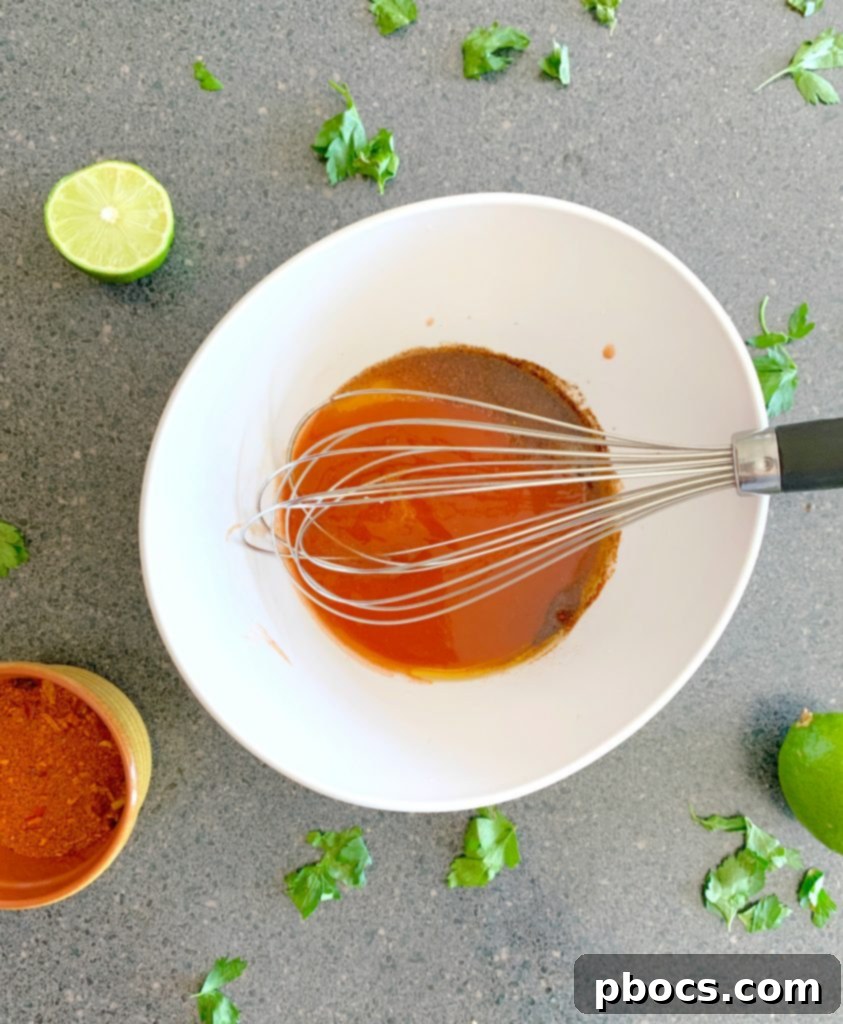 Mixing the buffalo chicken marinade ingredients in a bowl.